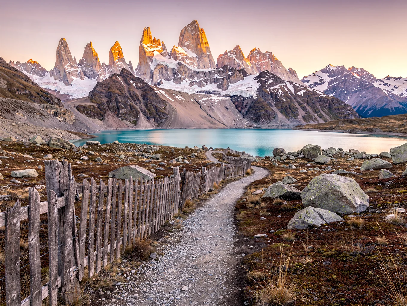 Jagged granite mountain peaks illuminated by dramatic dawn light in Patagonia